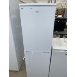 A WHITE LOGIK UPRIGHT FRIDGE FREEZER BELIEVED IN WORKING ORDER BUT NO WARRANTY