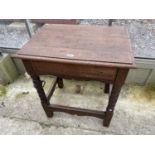 AN OAK JACOBEAN STYLE SIDE-TABLE ON BOBBIN TURNED LEGS WITH A SINGLE DRAWER 26" X 19"