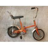 A CHILDS RALEIGH GT CHOPPER STYLE BIKE