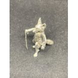 A MINIATURE SILVER STANDING FOX WITH CANE