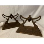 A PAIR OF CAST IRON FIRE DOGS