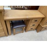 A LIGHT OAK DRESSING TABLE WITH THREE DRAWERS, TOGETHER WITH A STOOL, 45" WIDE