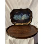 A LARGE WOODEN OVAL BUTLERS TRAY AND A DECORATIVE TIN TRAY WITH VEGETABLE BOWL DESIGN