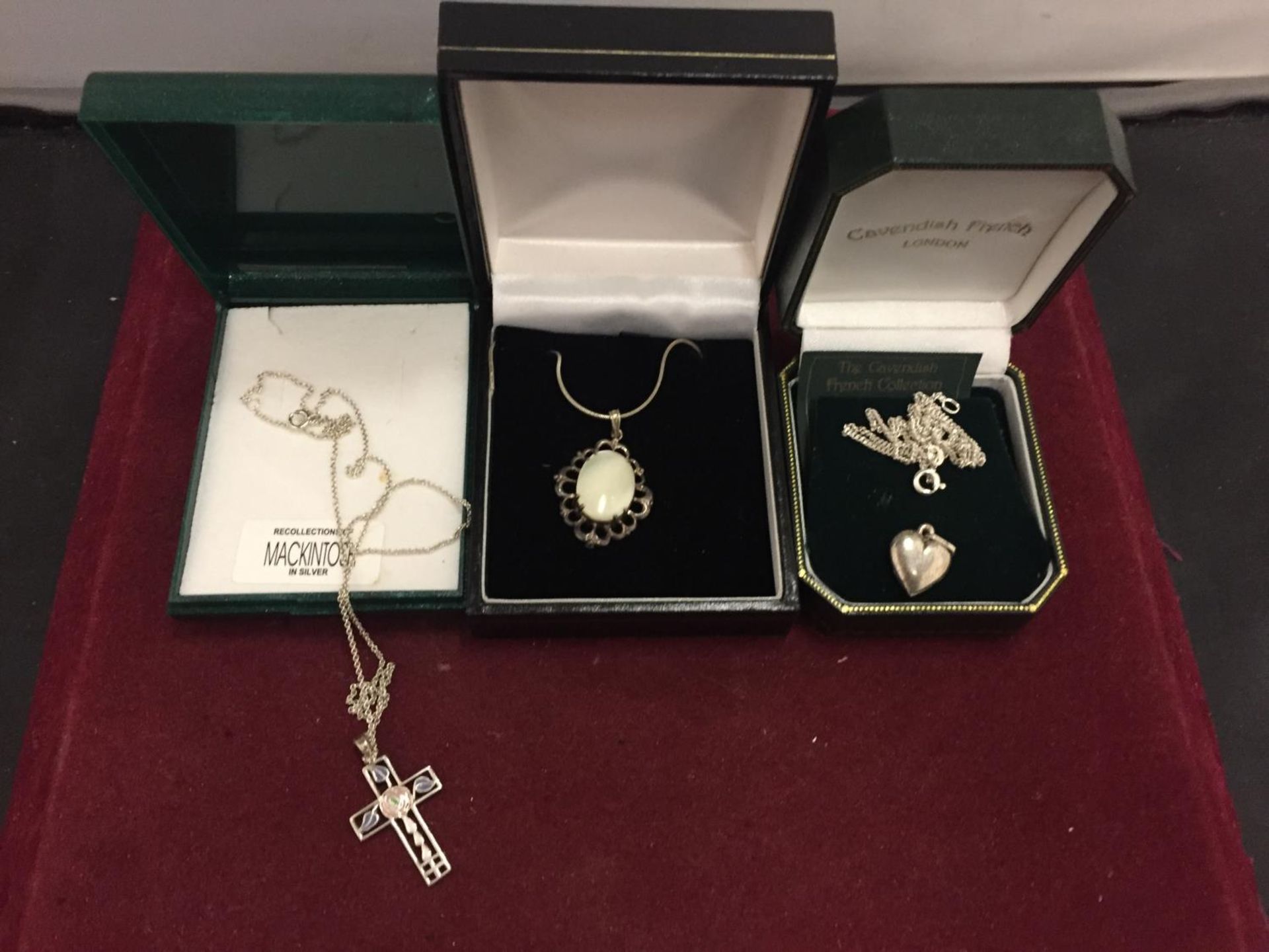 THREE SILVER NECKLACES WITH PENDANTS TO INCLUDE A CROSS, HEART AND A MOTHER OF PEARL ALL BOXED