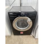 A BLACK HOOVER WASHING MACHINE BELIEVED IN WORKING ORDER BUT NO WARRANTY