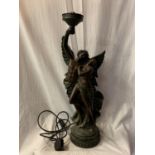 A LARGE SPELTER TABLE LAMP IN THE FORM OF A GUIDING ANGEL AND FEMALE COMPANION