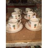 A COLLECTION OF SIX ARTHUR WOOD HAND DECORATED CUPS AND SAUCERS