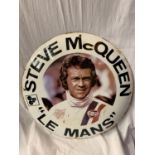 A LARGE ROUND ENAMEL 'STEVE MCQUEEN "LE MANS" ' SIGN DIAMETER 60CM