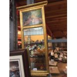 A GILT FRAMED BEVEL EDGED MIRROR WITH COURTING COUPLE SCENE TO TOP - 83CM X 31CM