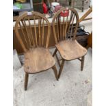 A PAIR OF ELM WINDSOR STYLE KITCHEN CHAIRS INSCRIBED TO THE BASE 'O.HAYNES, HIGH WYCOMBE, 1943'