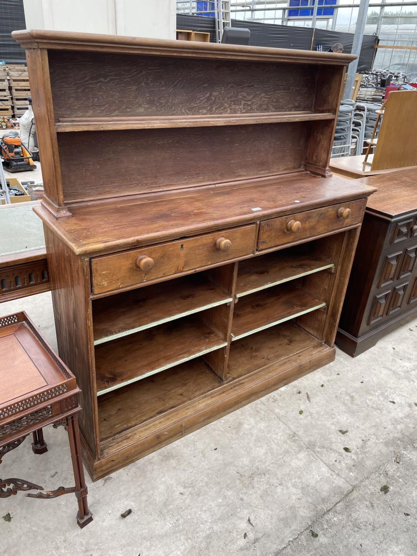 A VICGTORIAN PINE KITCHEN DRESSER WITH OPEN SHELVES TO THE TOP AND BASE, WITH TWO FRIEZE DRAWERS,