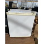 A WHITE COUNTER TOP FRIDGE BELIEVED IN WORKING ORDER BUT NO WARRANTY