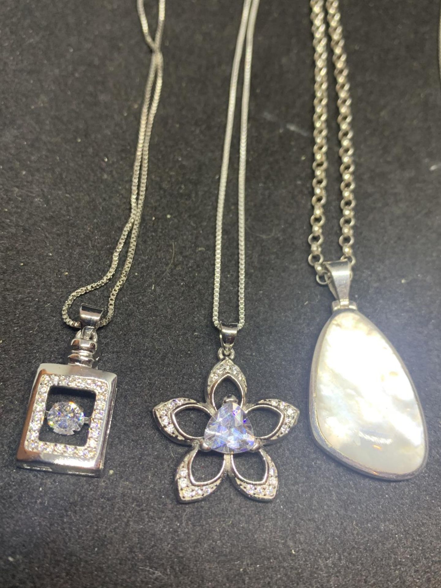 SIX SILVER NECKLACES WITH PENDANTS TO INCLUDE CLEAR STONE FLOWERS, CROSS ETC - Image 2 of 3