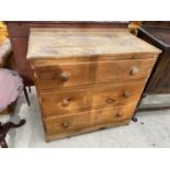 A VICTORIAN PINE CHEST OF THREE GRADUATED DRAWERS W: 39 INCHES