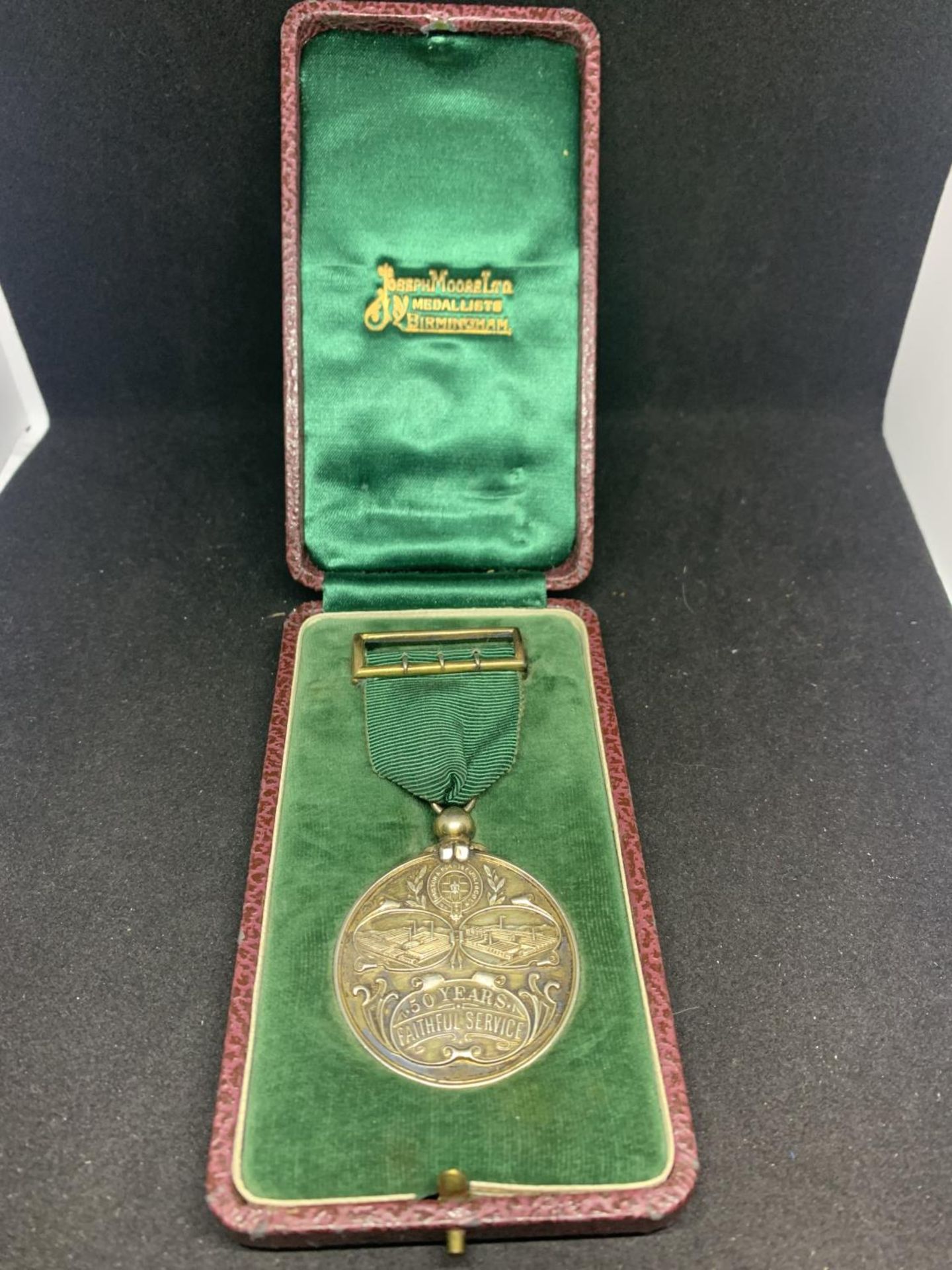 A HALLMARKED SILVER 50 YEARS FAITHFUL SERVICE MEDAL IN A PRESENTATION BOX