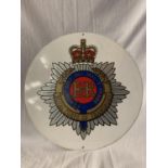 A CIRCULAR METAL 'ROYAL CORPS OF TRANSPORT' SIGN - DIA: 36CM