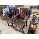 A PAIR OF DECORATIVE WOODEN GARDEN CHAIRS