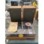 A GARRARD RECORD PLAYER WITH A PAIR OF DYNATRON SPEAKERS BELIEVED IN WORKING ORDER BUT NO WARRANTY