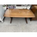 AN ERCOL ELM COFFEE TABLE 50" X 27"