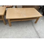 A LIGHT OAK TWO TIER COFFEE TABLE BY SKOVBY WITH PULL-OUT SLIDE AND SMALL SECRET TYPE DRAWER, 52x30"