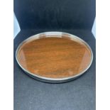 A SILVER EDGED SMALL WOODEN TRAY