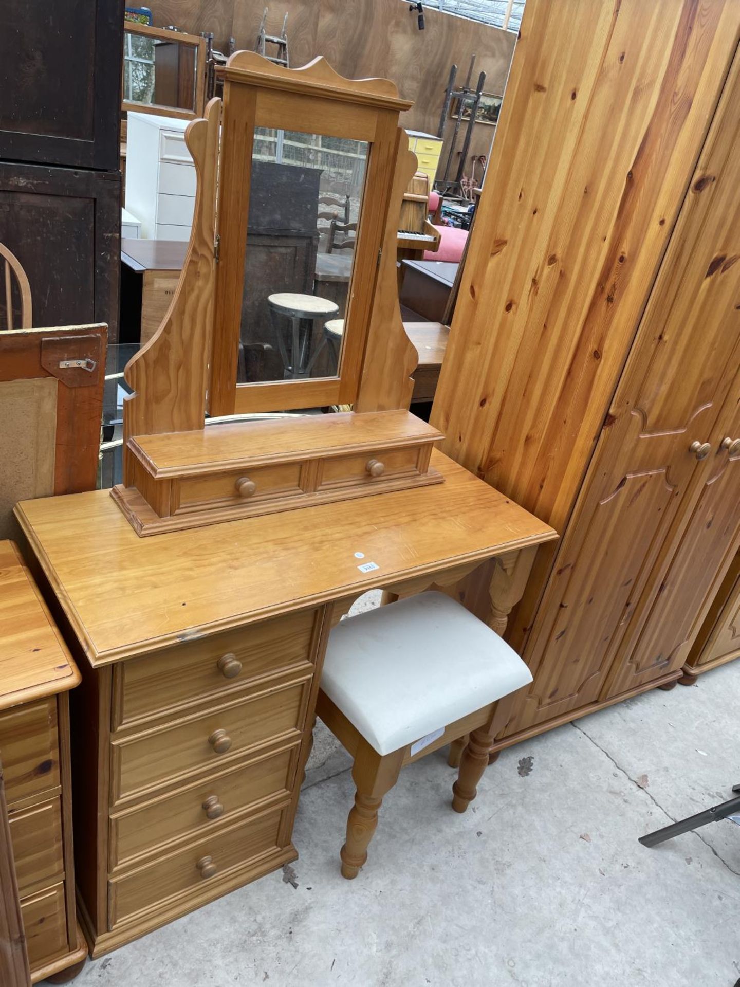 A PINE DRESSING TABLE AND STOOL