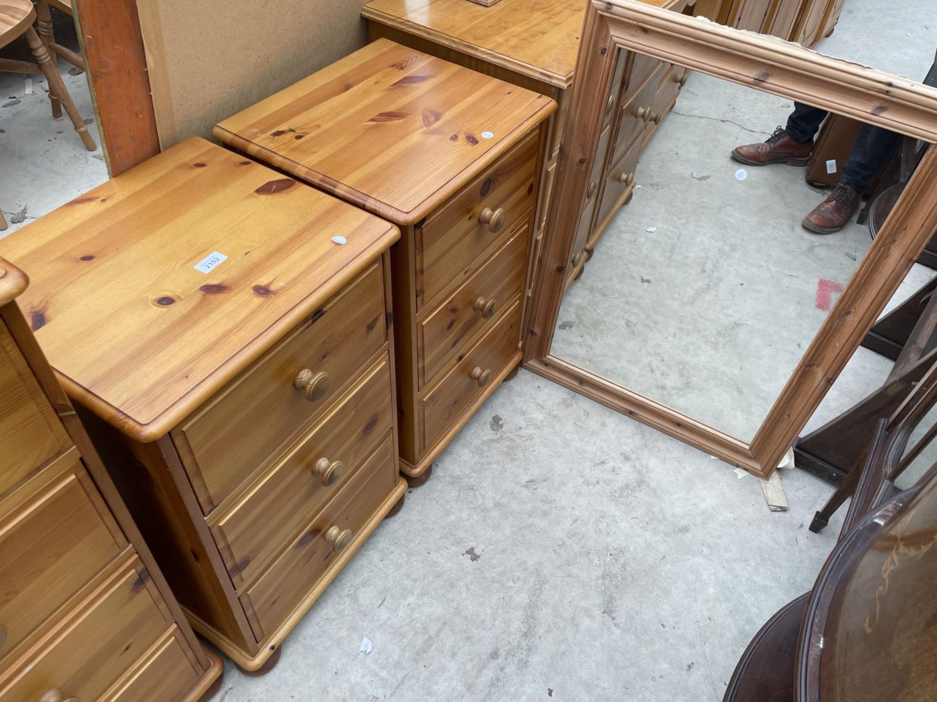 A PAIR OF PINE BEDSIDE CHESTS AND A MIRROR