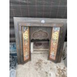 A DECORATIVE CAST IRON AND TILED FIRE SURROUND