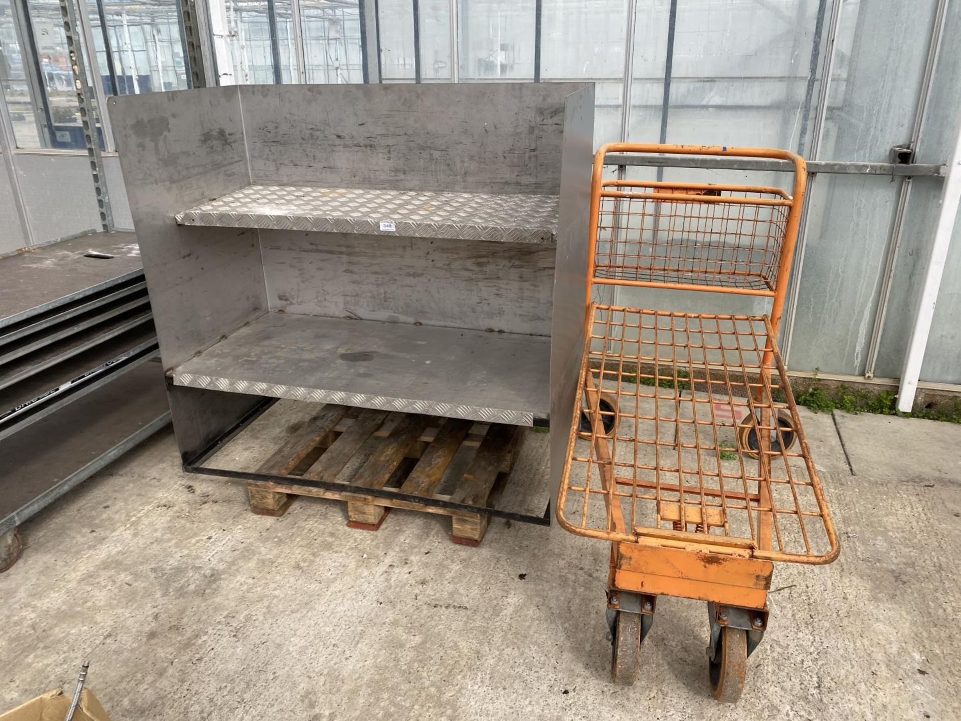 A METAL SHELVING UNIT AND A FOUR WHEELED TROLLEY NO VAT