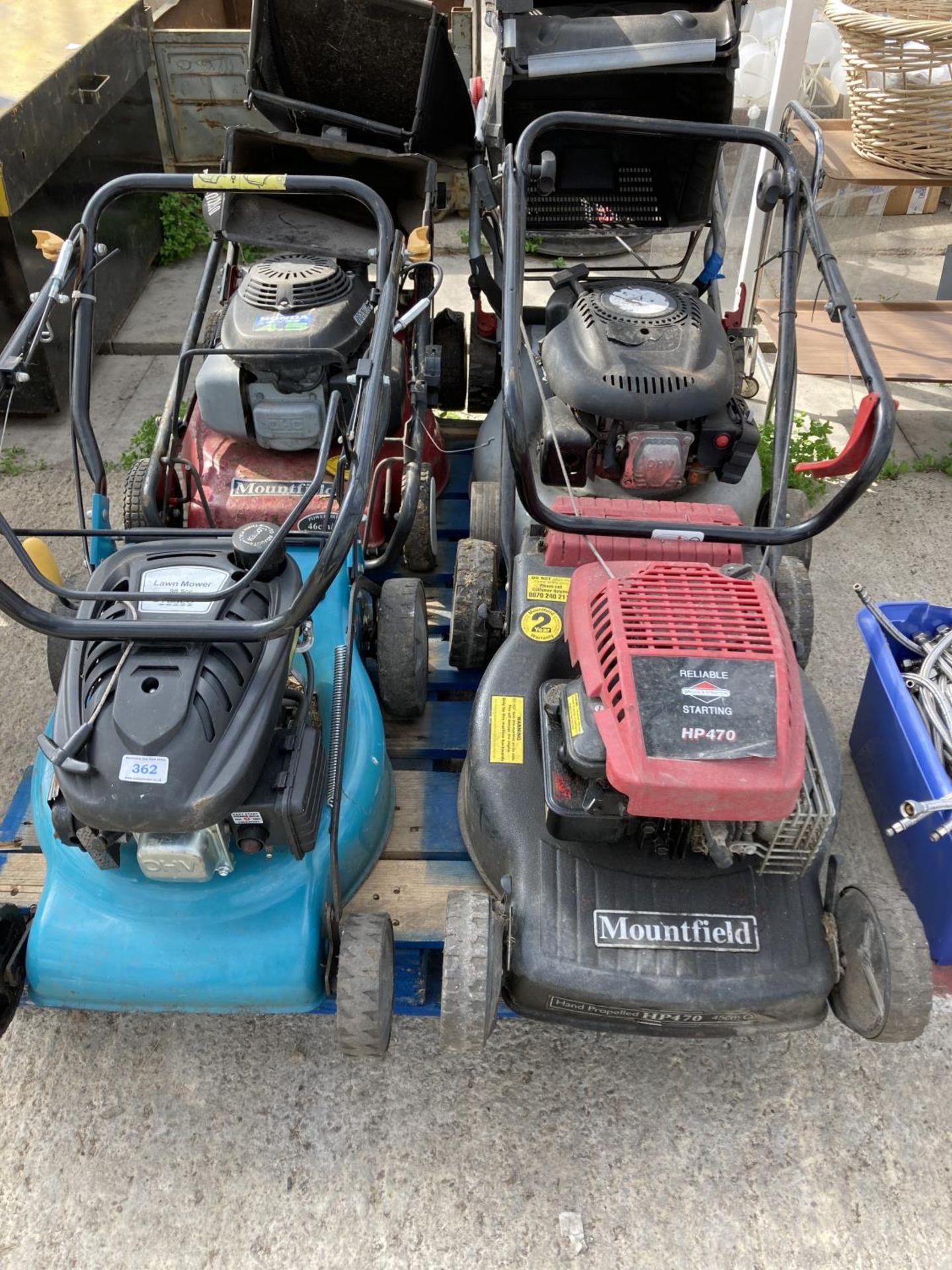 FOUR LAWNMOWERS TO INCLUDE TWO MOUTFIELD, A TESCO AND A WOLF GT 20SP + VAT