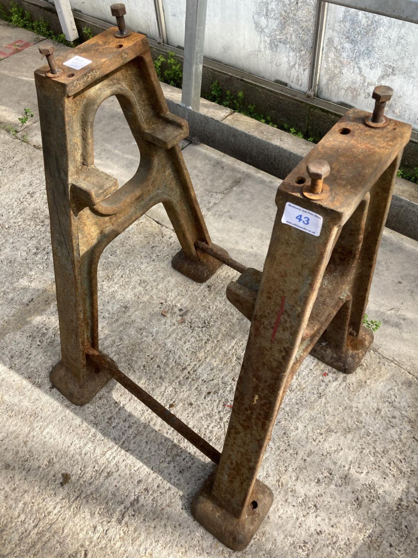 A CAST IRON TABLE BASE AND A BARRIER - N0 VAT