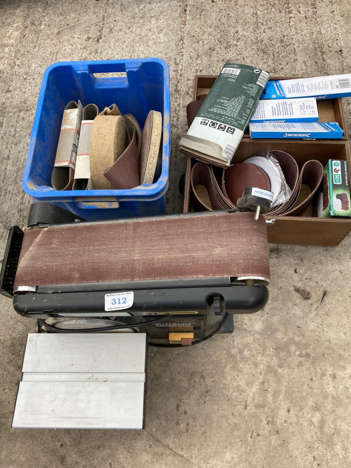 A RUTLAND SANDER AND TWO BOXES OF BELTS NO VAT