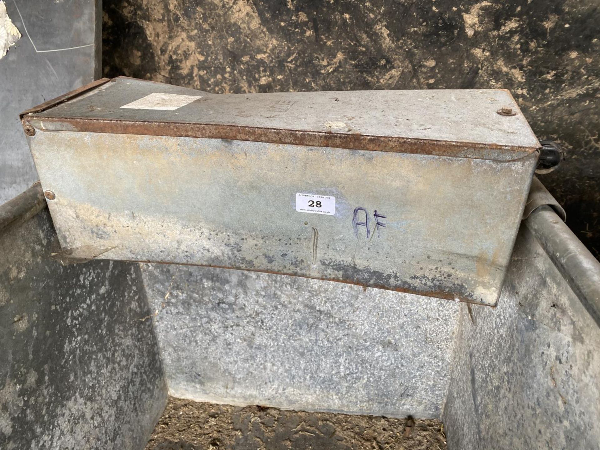 A LONG GALVANISED CATTLE WATER TROUGH 10; 6" LONG (AT FAULT)