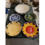 A COLLECTION OF LARGE CERAMIC BOWLS AND A BLUE AND WHITE PLATE
