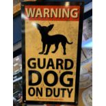 A METAL 'WARNING GUARD DOG ON DUTY' SIGN - 35.5CM X 20.5CM