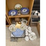 A LARGE COLLECTION OF CERAMIC WARE TO INCLUDE PATTERNED PLATES, CUPS AND SAUCERS, AND SERVING DISHES