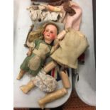 A COLLECTION OF VINTAGE DOLL PARTS AND CLOTHES