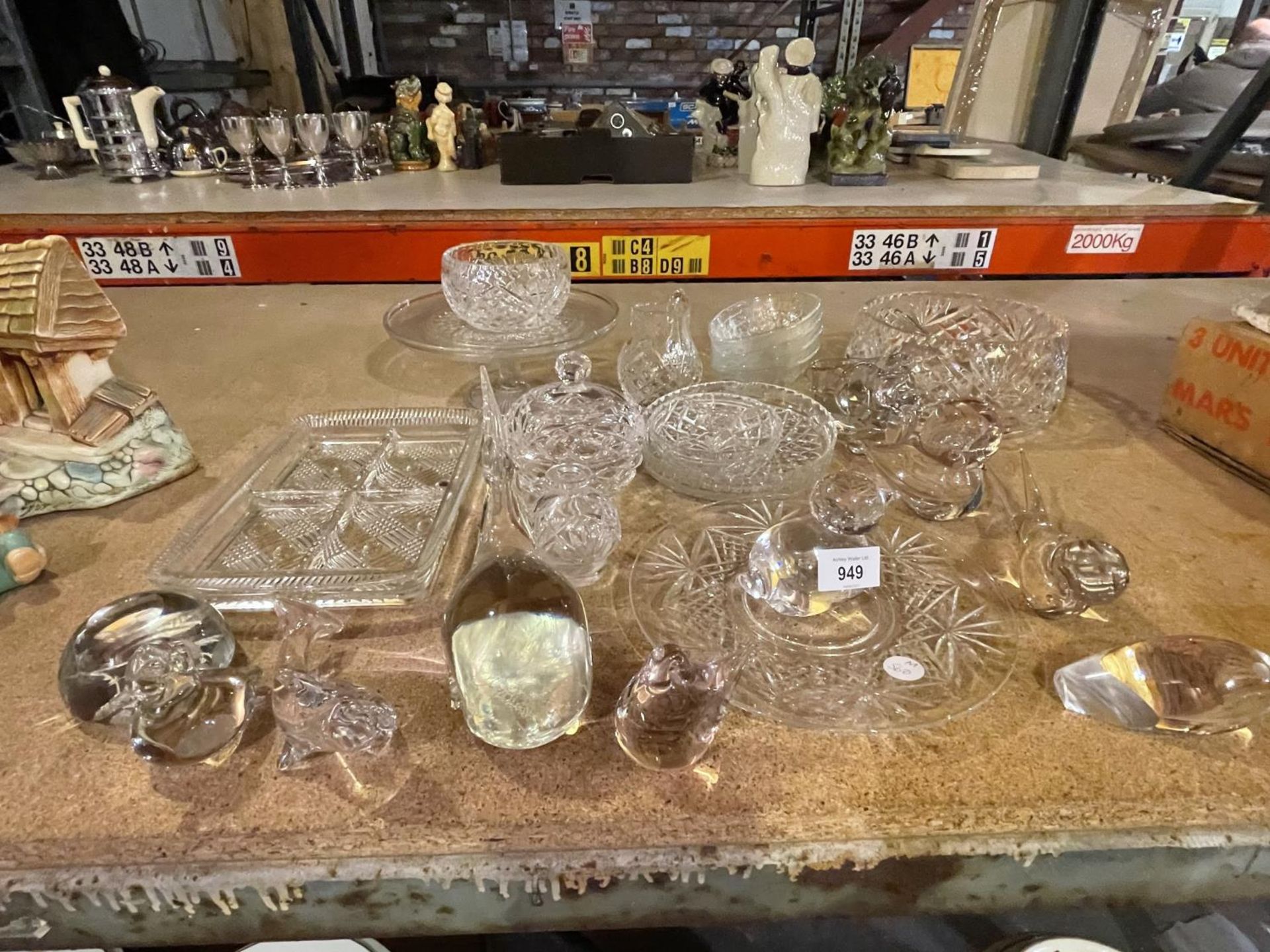A QUANTITY OF GLASSWARE TO INCLUDE CUT GLASS BOWLS AND DISHES AND GLASS PAPER WEIGHTS