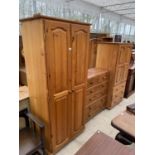 A MODERN PINE TWO DOOR WARDROBE, TWO DOOR WARDROBE WITH THREE DRAWERS AND CHEST OF TWO LONG AND