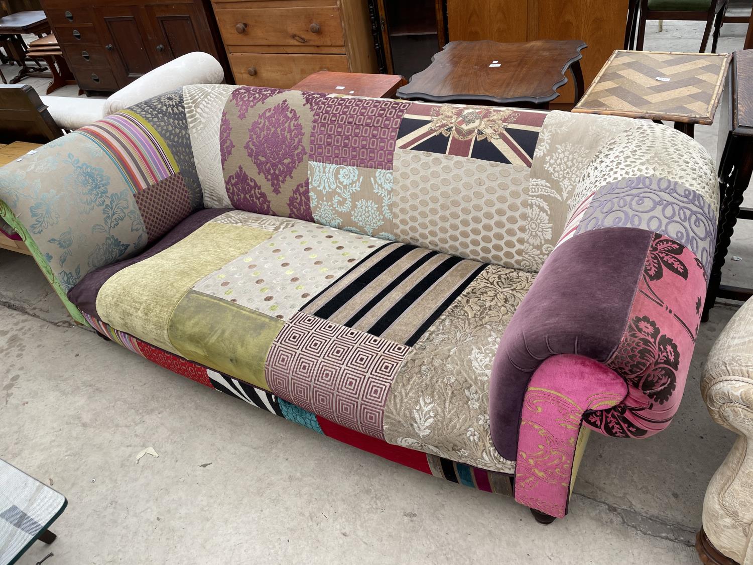 AN UNUSUAL PATCHWORK TWO SEATER SOFA