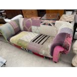 AN UNUSUAL PATCHWORK TWO SEATER SOFA