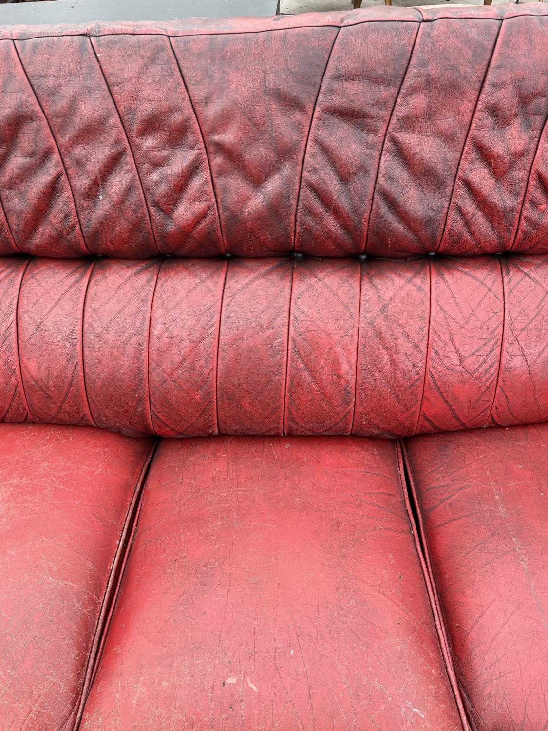 AN OXBLOOD THREE SEATER SETTEE - Image 3 of 6