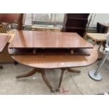 A REGENCY STYLE MAHOGANY TWIN-PEDESTAL DINING TABLE 53" X 41.5" WITH TWO EXTRA LEAVES 22.5" EACH