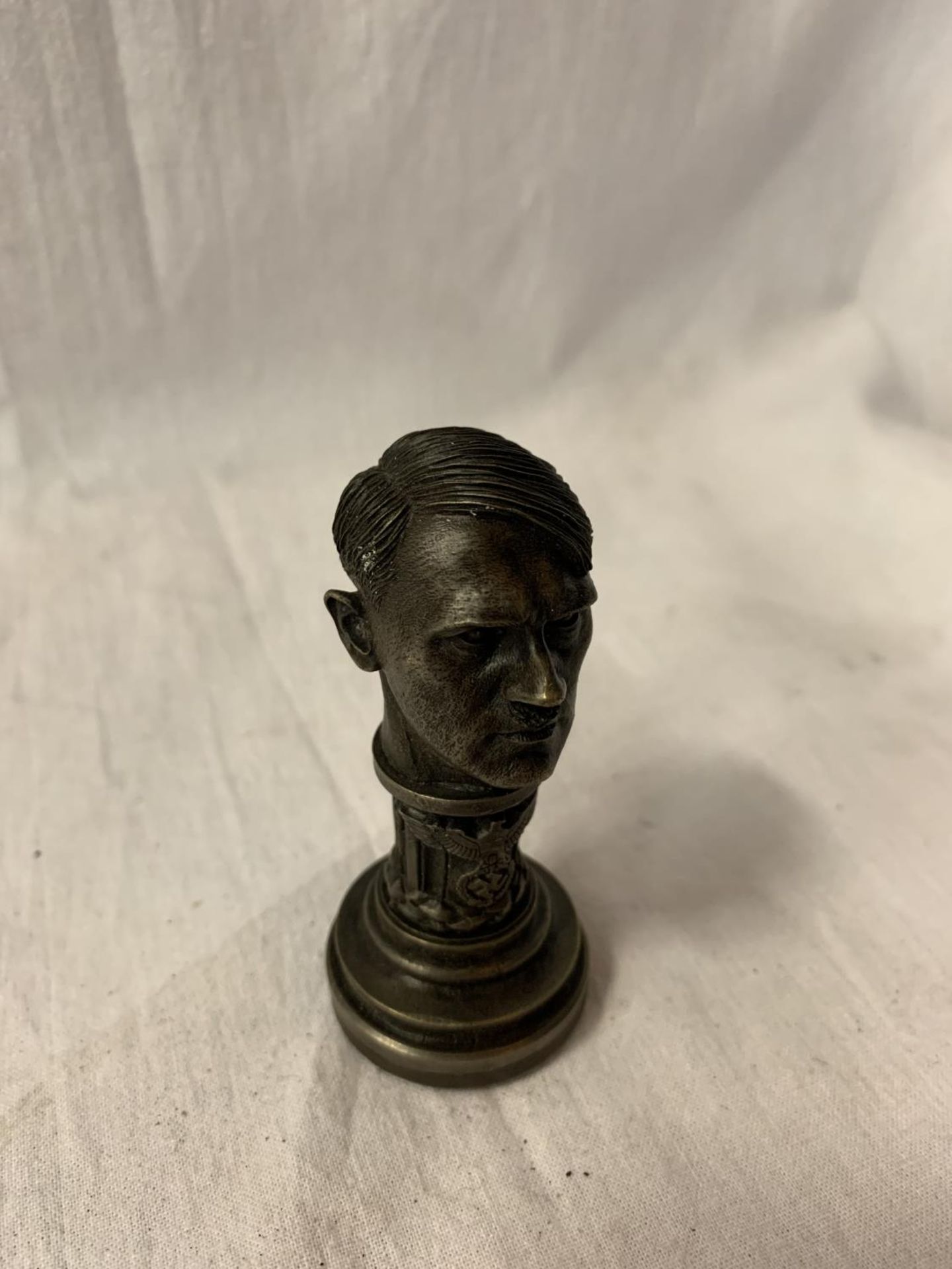 A BRONZE STAMP IN THE FORM OF AN ADOLF HITLER BUST H:9CM