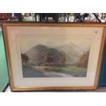 A LARGE GILT FRAMED PRINT OF SHEEP GRAZING BY A STREAM AT THE FOOT OF A MOUNTAIN