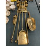 A BRASS COMPANION SET AND FIREDOGS TO INCLUDE A SHOVEL ETC