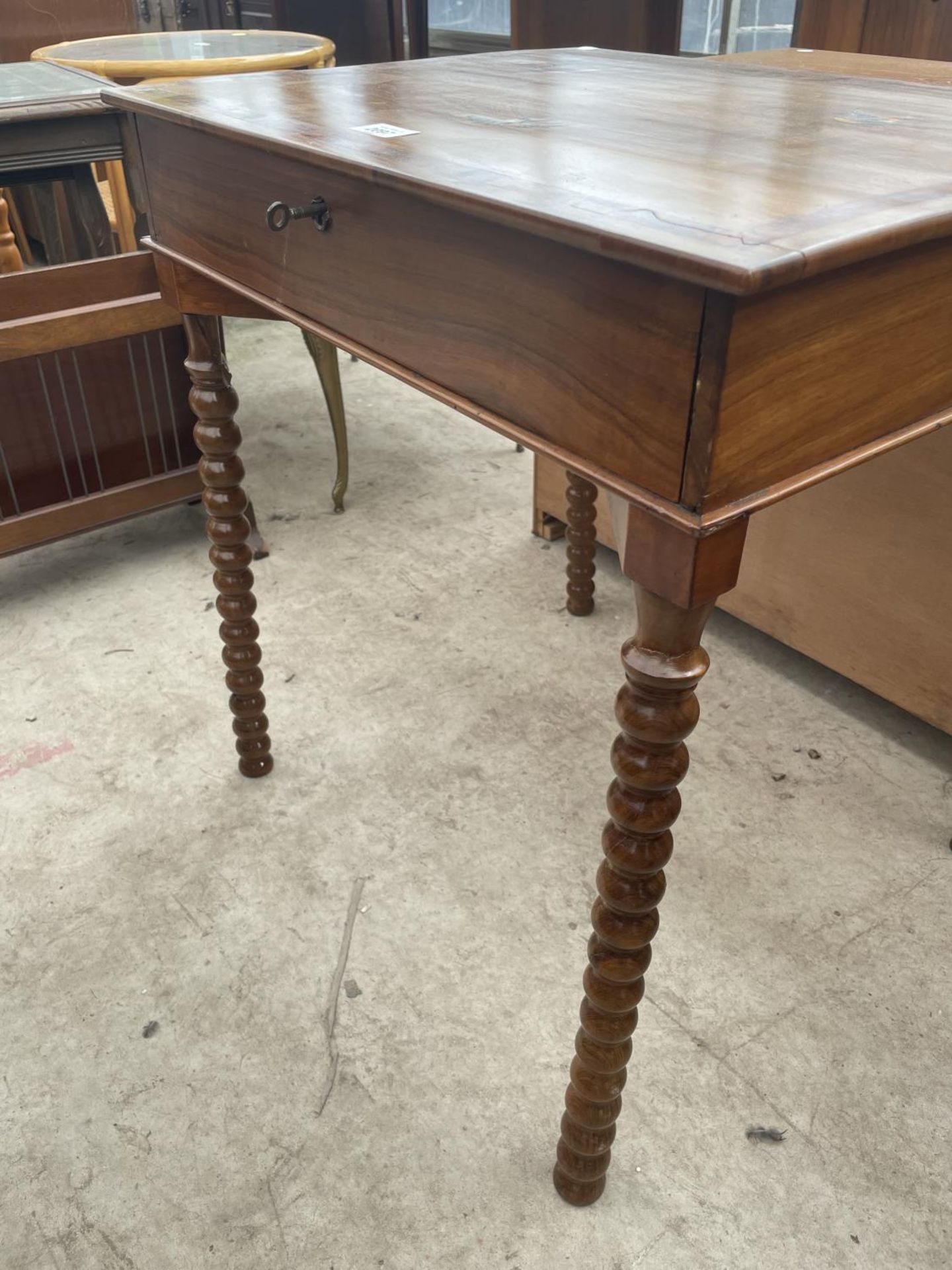 A SMALL WALNUT AND INLAID TABLE WITH SWALLOW DECORATION ON TURNED LEGS WITH SINGLE DRAWER, 22X17.5" - Image 3 of 6