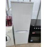 A WHITE HOTPOINT UPRIGHT FRIDGE FREEZER BELIEVED IN WORKING ORDER BUT NO WARRANTY