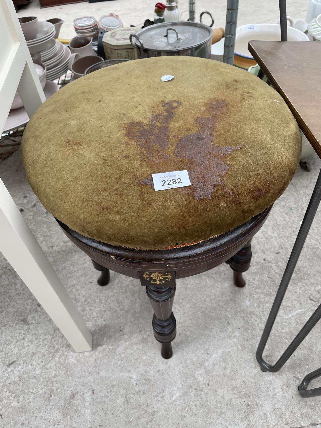 A VICTORIAN ROSEWOOD AND INLAID ADJUSTABLE PAINO STOOL ON FOUR TURNED LEGS