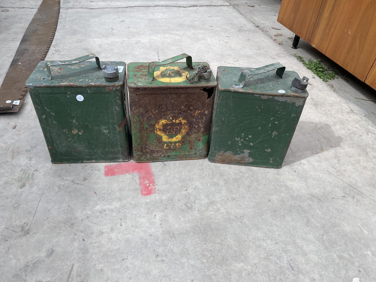 THREE VINTAGE FUEL CANS WITH ORIGINAL CAPS TO INCLUDE A 'PRATTS' AND TWO 'BP'